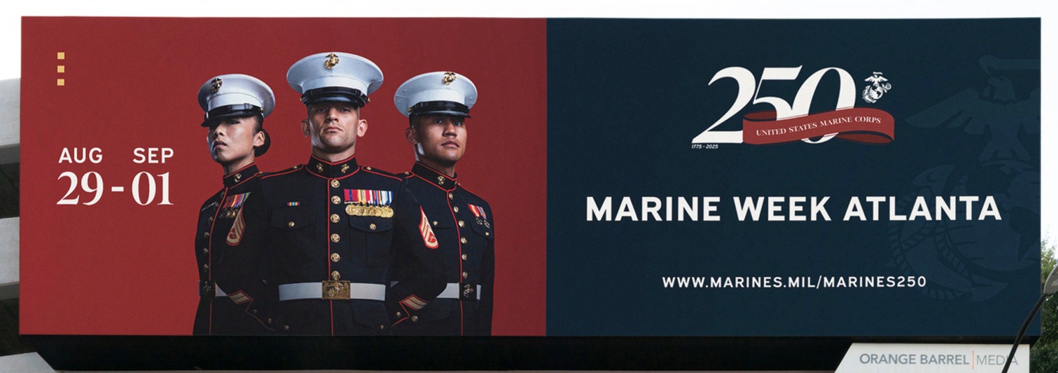 Billboard for Marine Week Atlanta showing three U.S. Marines in dress uniform, event dates August 29 to September 1, and the message "250 United States Marine Corps" with website link.