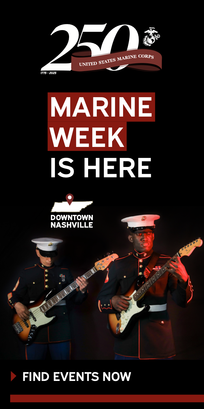 Two U.S. Marines in uniform play electric guitars on stage. The text reads: "United States Marine Corps 250th. Marine Week is here. Downtown Nashville. Find events now.