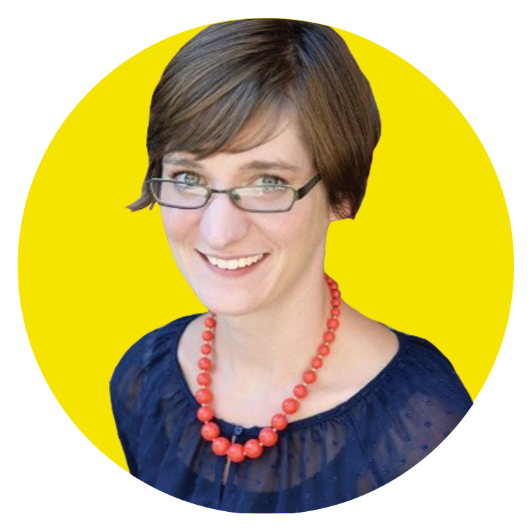 Woman with short brown hair and glasses, wearing a navy blouse and red beaded necklace, smiling in front of a bright yellow circular background—radiating the approachable confidence you’d expect from a creative agency professional. Woman with short brown hair and glasses, wearing a navy blouse and red beaded necklace, smiling in front of a bright yellow circular background—radiating the approachable confidence you’d expect from a creative agency professional.